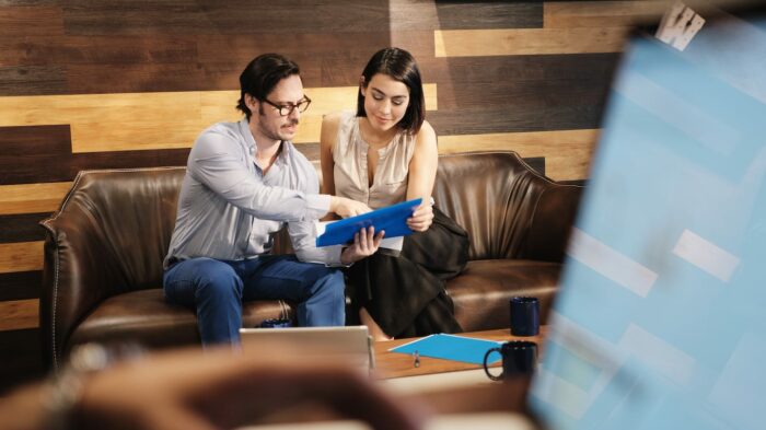 business man and woman meeting at work in office QX9VMGL