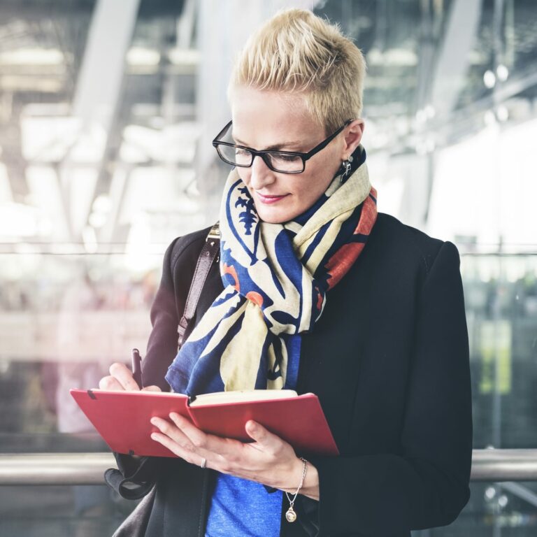 businesswoman writing waiting flight concept PA72YZ6