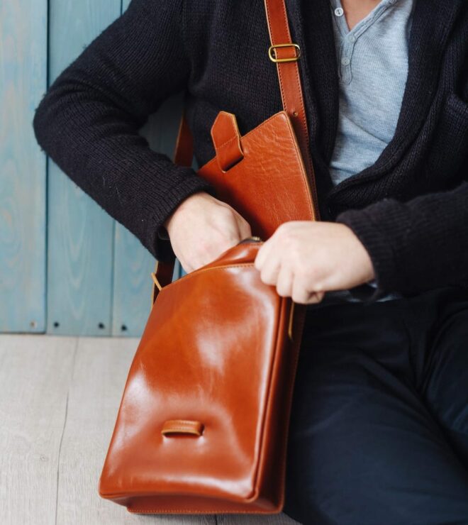 handsome guy with leather bag YXUVNZK