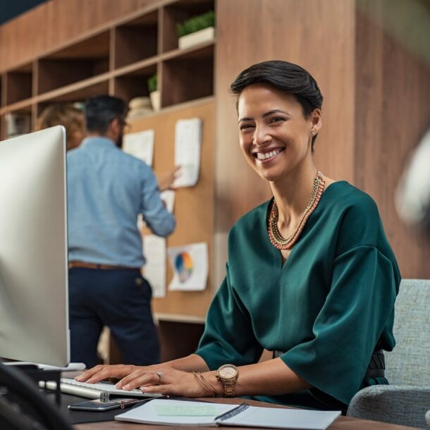 young businesswoman smiling at office LGQRJY2