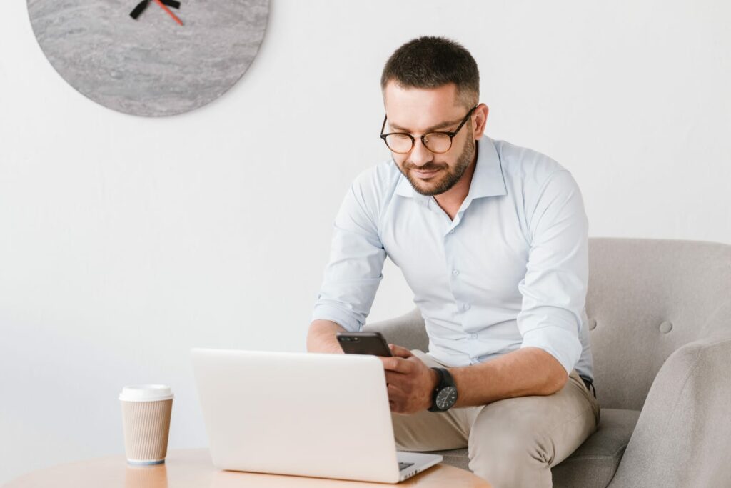 photo of business man wearing eyeglasses sitting PB3SK4U