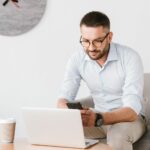 photo of business man wearing eyeglasses sitting PB3SK4U